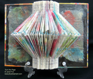 Image of a encaustic, mixed media 3-D journal art by Janet Fox titled "Turn the Page."