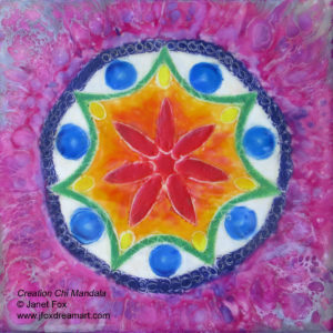 An encaustic mandala painting "Creation Chi Mandala" by Janet Fox with rainbow colors