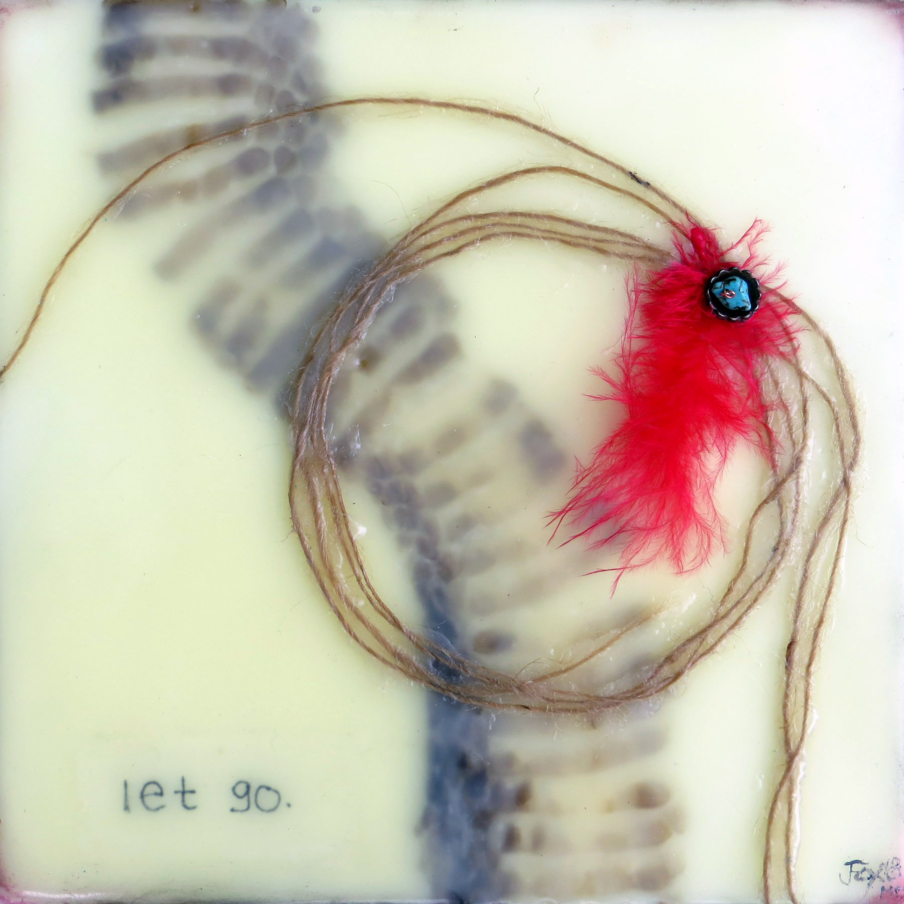Image of an encaustic painting by Janet Fox including shedded snake skin, twine, red feather, copper bead and turquoise bead with the words "Let Go."